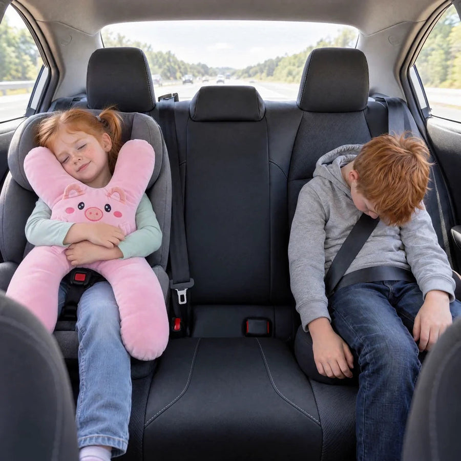 Two kids in the same back seat: the girl with her Ollie SnuggoWay naps with her head up, her brother without one slumps forward