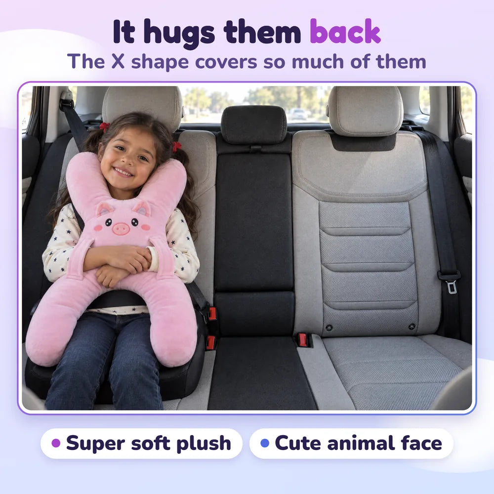 It hugs them back: a girl hugging Ollie the Piggy in the car